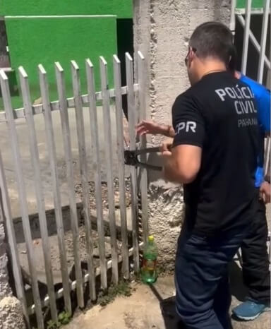 Rescuers cutting the lock of the gate