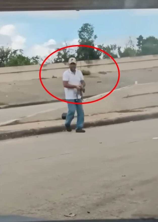 Rescuer bringing her in the car